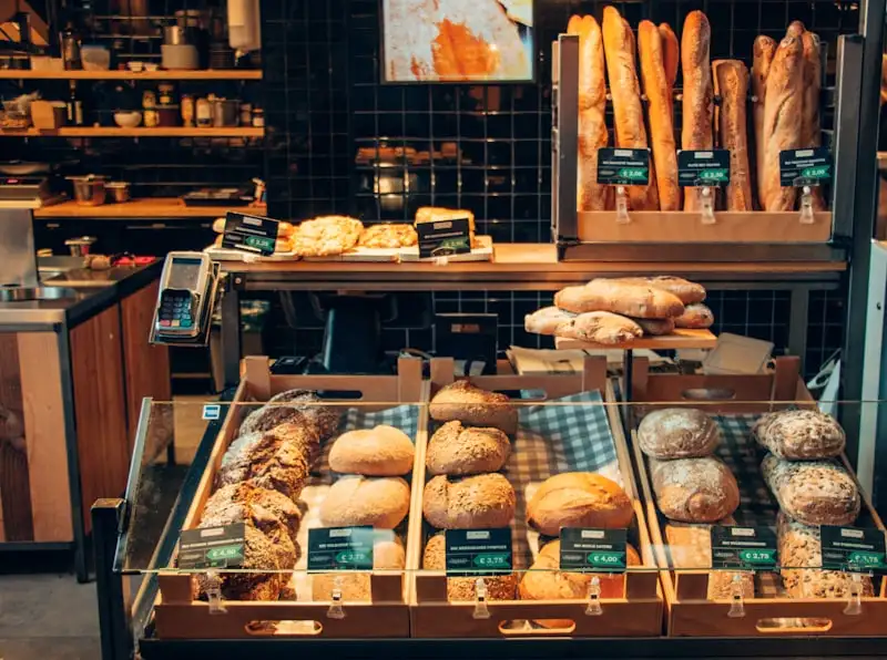 Butter and Crumb's counter stacked with fresh loaves and pastries